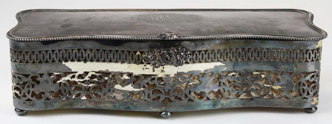 Derby Silver Co. Victorian jewelry casket: Derby Silver Co. Victorian reticulated silverplate jewelry casket with reticulated sides, beaded edge, and script monogram on lid, lined in yellow sill, on 6 ball feet, with original key