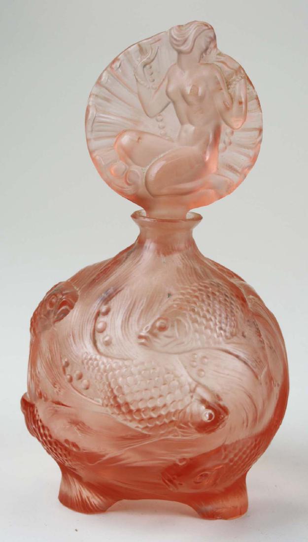 Ingrid Curt Schlevogt glass pink perfume: Depression glass pink perfume by Ingrid Curt Schlevogt the birth of Venus pattern 7" high. Czech. A female nude stopper with a body of carp swimming in seaweed.