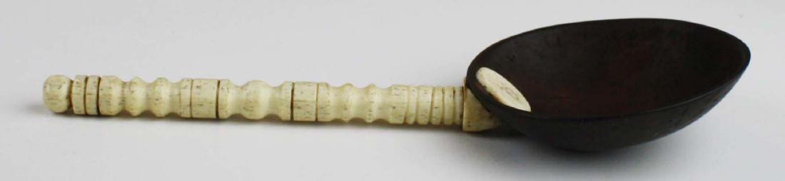 mid 19th c scrimshaw coconut shell dipper: mid 19th c scrimshaw coconut shell dipper w/ whale bone handle, length 9"