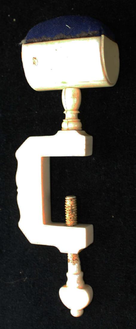 mid 19th c scrimshaw sewing clamp pin cushion: mid 19th c scrimshaw carved whale bone sewing clamp pin cushion, length 5 3/4"