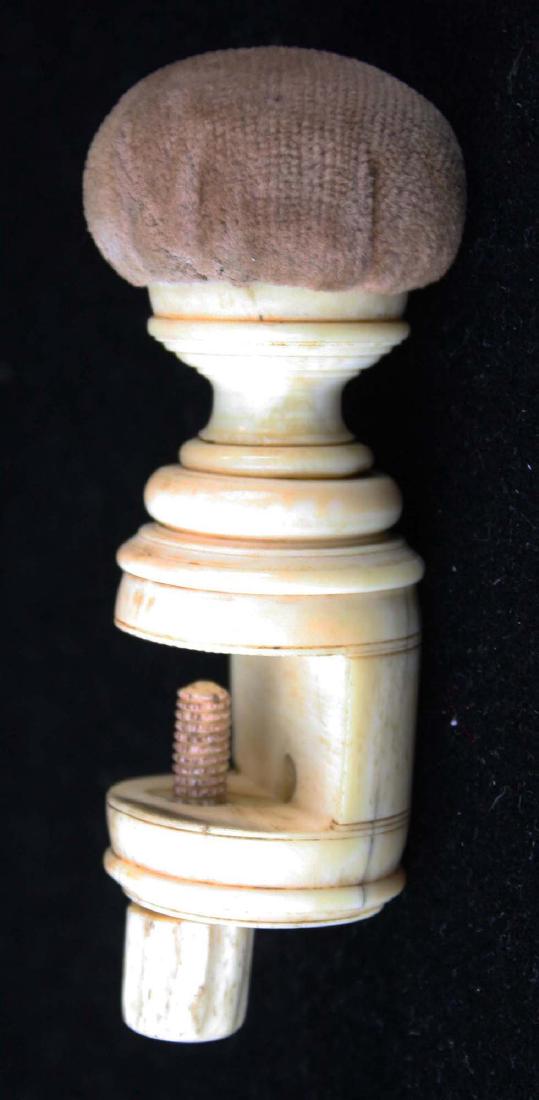 mid 19th c scrimshaw sewing clamp pin cushion: mid 19th c scrimshaw carved whale bone sewing clamp pin cushion, length 4 3/4"