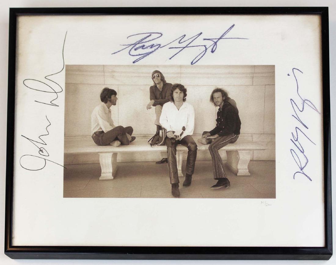 The Doors autographed limited numbered print: The Doors autographed limited numbered print 81/ 200 with coa letter from Elektra Records, signed by Robby Kreiger, Ray Manzarek, & Jon Densmore, a 1969 b&w photo of the four band members (
