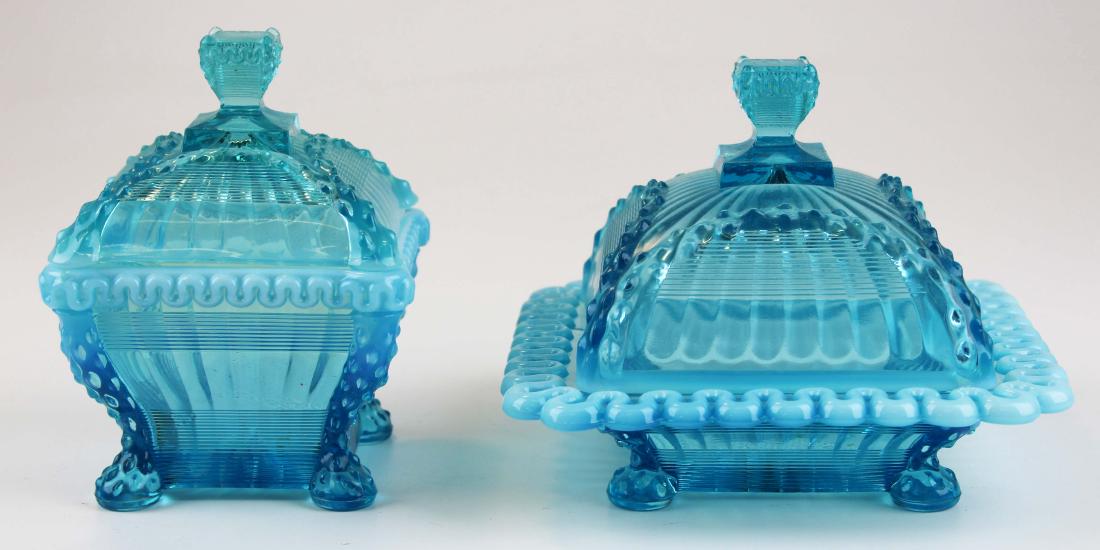 late 19th c blue opalescent pattern glass: 2 late 19th c blue opalescent pattern glass covered dishes, ht 5" to 5 1/2"