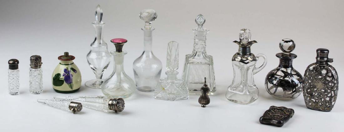 Collection of perfume bottles including sterling: Collection of perfume bottles and small articles including sterling silver matchsafe with thistles, sterling overlay flask, sterling overlay perfume bottle, 4 cut glass scent flasks with sterling caps