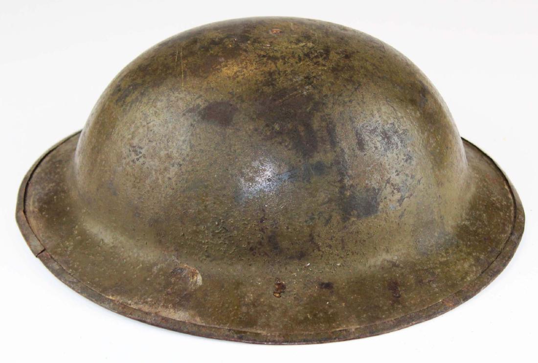 WWI signed doughboy trench helmet: WWI signed US Army doughboy trench helmet- ("Pvt Frank R Powell 45, 103rd Thu Nov 28, 1917 US Inf Med Dept" signed in pencil under brim, paper address label says from H C Petty WWI), British issue Bro