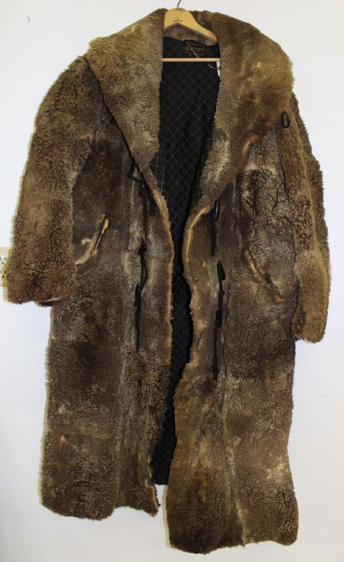 Vintage 1905 light colored buffalo robe coat: Dated 1905 Gordon & Ferguson St. Paul light colored buffalo robe coat. Lined interior. Approx size 44 Long . Some fur loss. Leather arm pits.