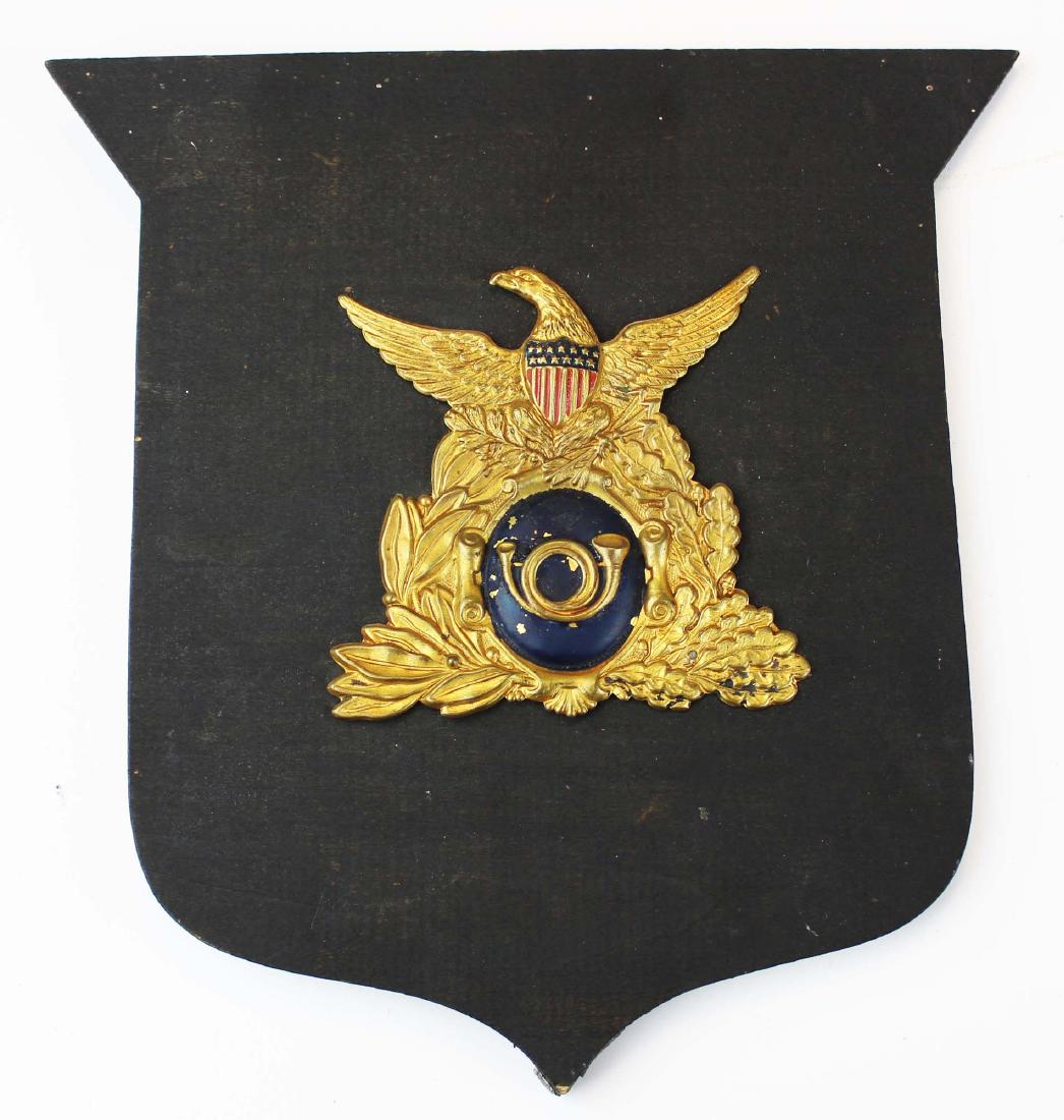 pre Civil War/ Civil War era hat badge: pre Civil War- Civil War era hat badge, from a US Army hat worn 1830- 1850, also worn in the Civil war by several Pa Regiments, & by the Veteran's Reserve Corps, ht 4", mounted on a wooden plaque