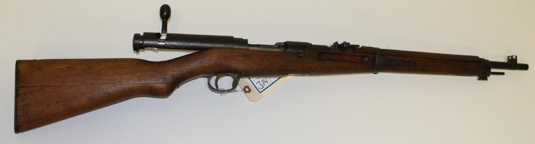 Japanese Type 38 Arisaka Rifle in 6.5mm: World War II Era Japanese type 38 Rifle in 6.5mm -Battlefield Capture with Imperial Mon intact and unusual dust cover in place- This firearm is to be sold in accordance with Federal Law. Buyer must pa