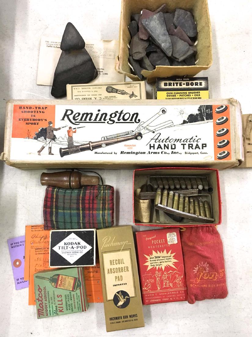 A group of hunting related items in original boxes: A group of mid 20th c sporting items many in original boxes including Rimington Hand trap clay pigeon thrower in box, pocket heater, Brite-bore, Matco repelant.