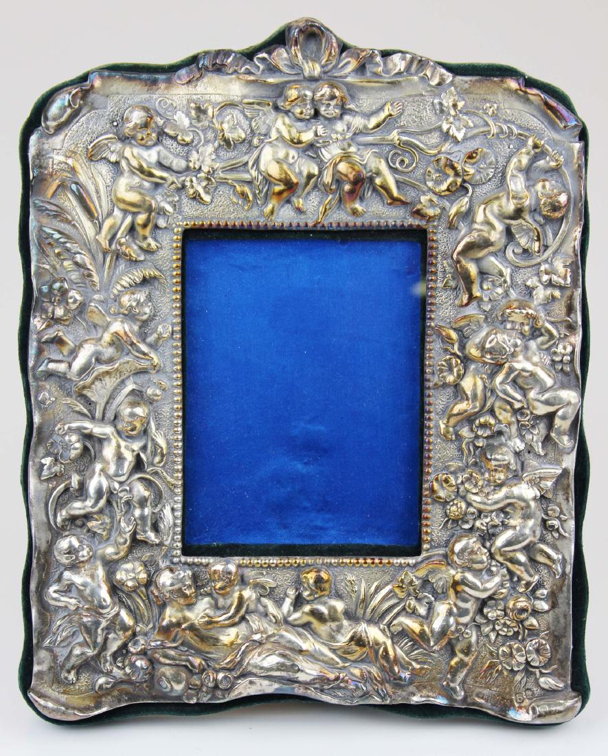 Ornate sterling repousse picture frame with putti (1 of 6)