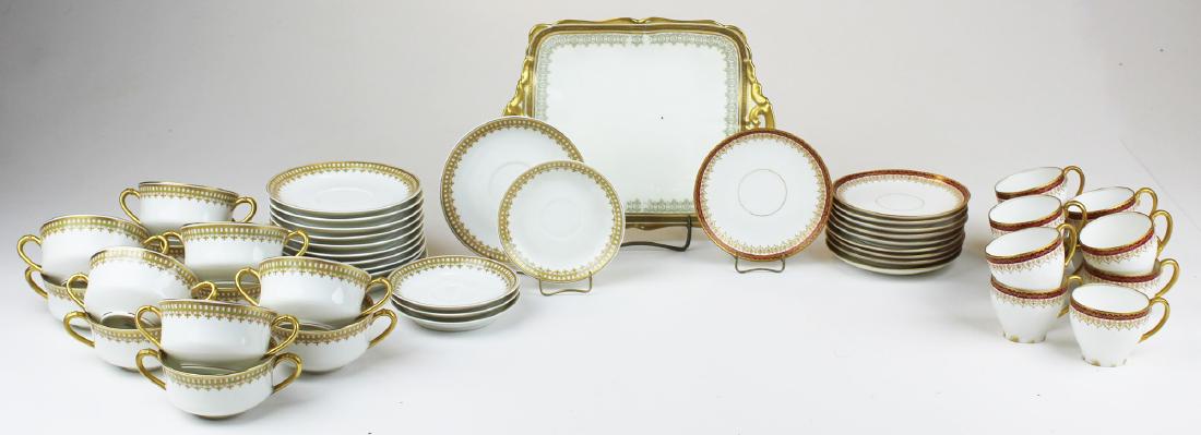 set of Limoges bouillon soups and demitasse: set of 11 gilt Limoges porcelain double handled bouillon soups with saucers and 10 gilt and maroon edge demitasse cups and saucers