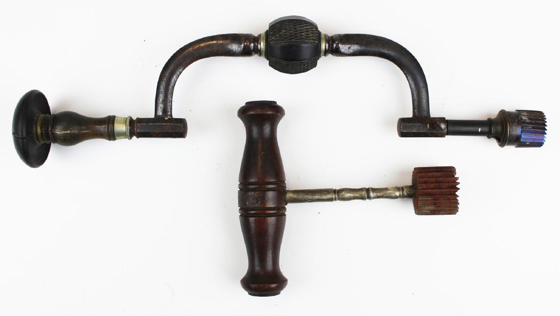 Two 19th c Trephine skull drills: Two 19th c Trephine skull drills. One walnut hand auger 4 1/2" long, second ebony wood handle mount drill with blued bit. 11" long.