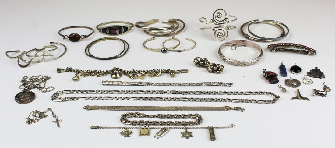 Sterling jewelry: Group of sterling jewelry including bracelets, bangles, charm bracelets, necklaces, pendants. 11.5 troy oz. t.w