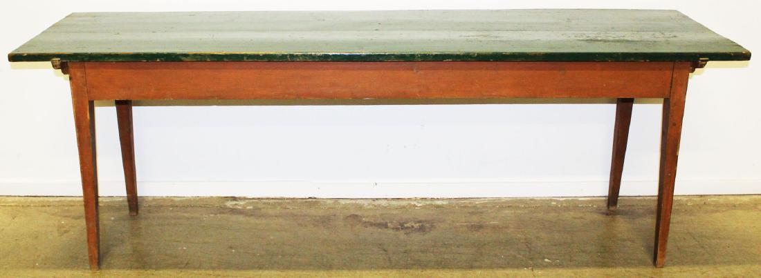 Green painted single board top harvest table: 7'7" green painted pine single board top tapered leg harvest table. Pegged, probably early 20th c , signed in chalk. 25"w x 31"h