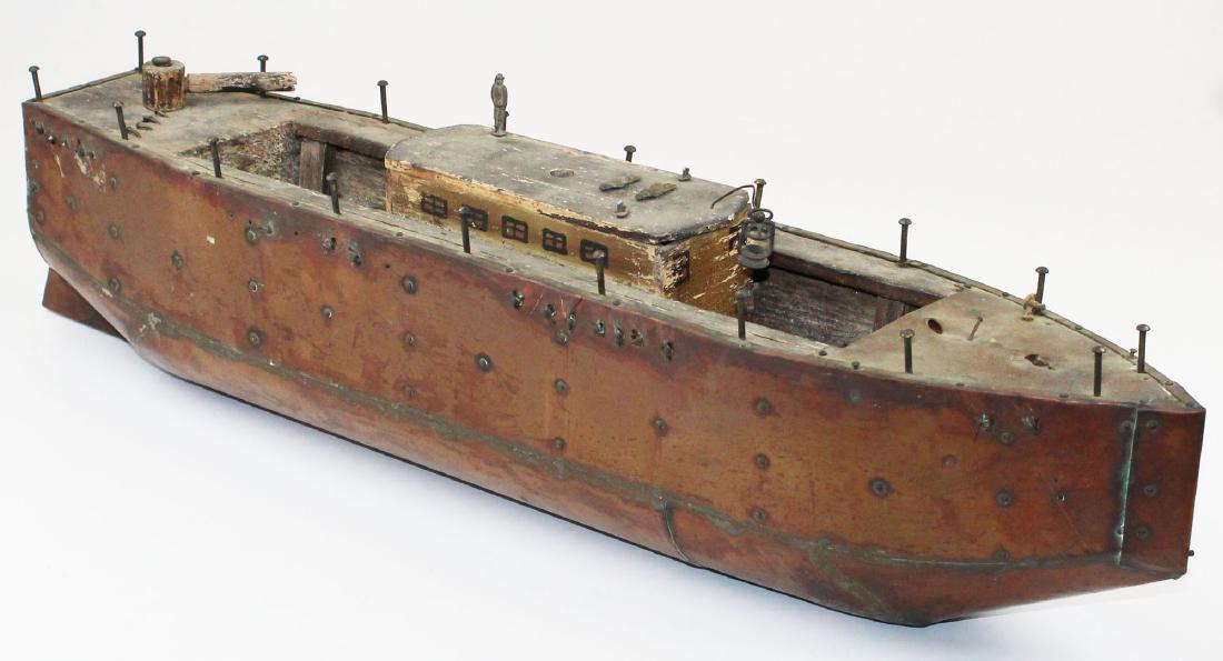 copper clad folk art model steamboat: folk art model steamboat made from a block of carved wood clad in copper with brass tacks 6.5" x 25" x 5"