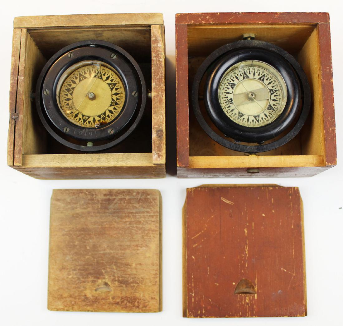 Two WWII Era Nautical compasses: Two WWII Era Nautical compaasses in red painted boxes, one Star&Co Boston with significant wear, one Wilcox and Crittenden each case 4.5 x.4.5 x 3"