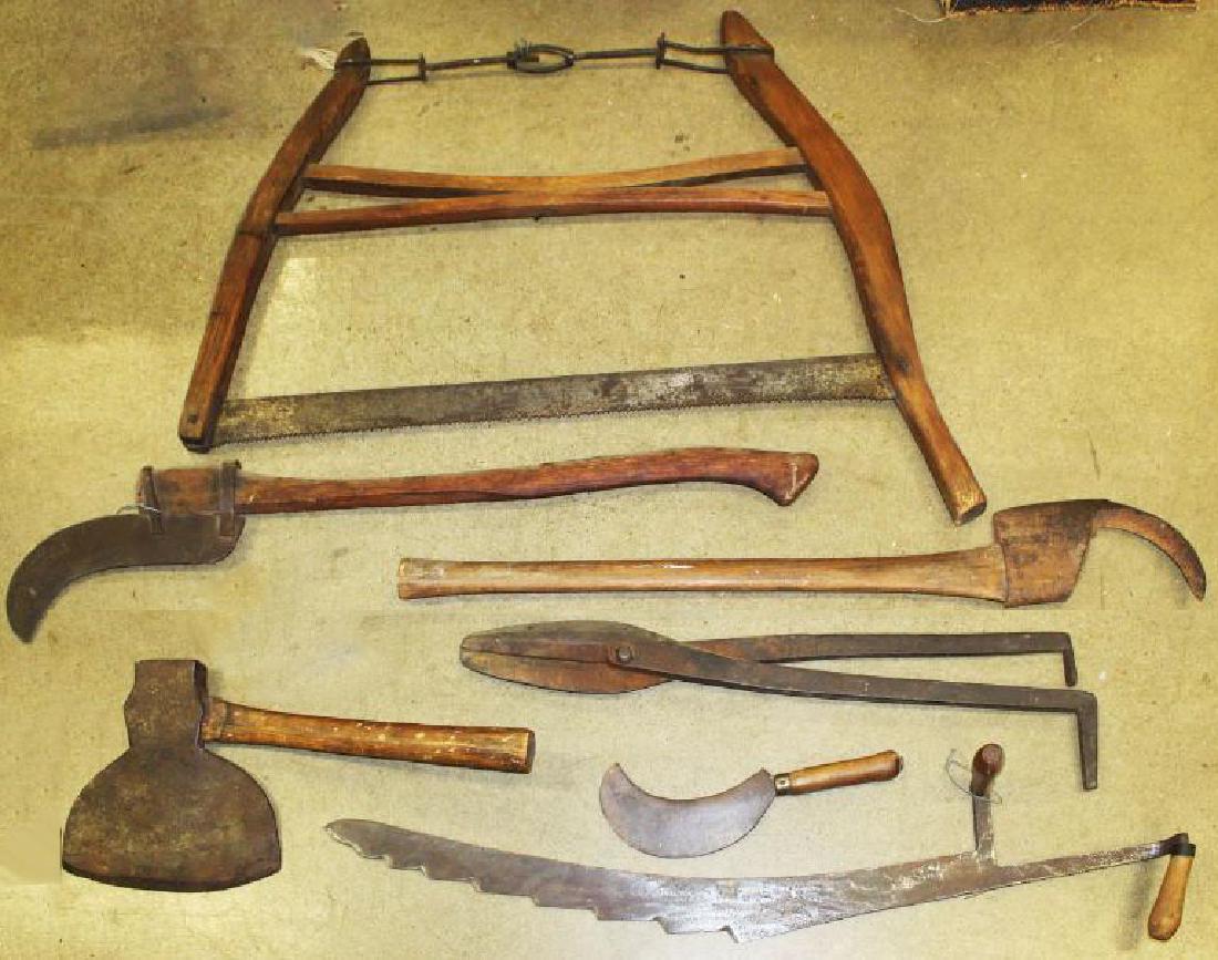 Lot of early hand tools: Lot of Hand tools included marked broad axe, saws, hay saw, snips etc. seven pieces