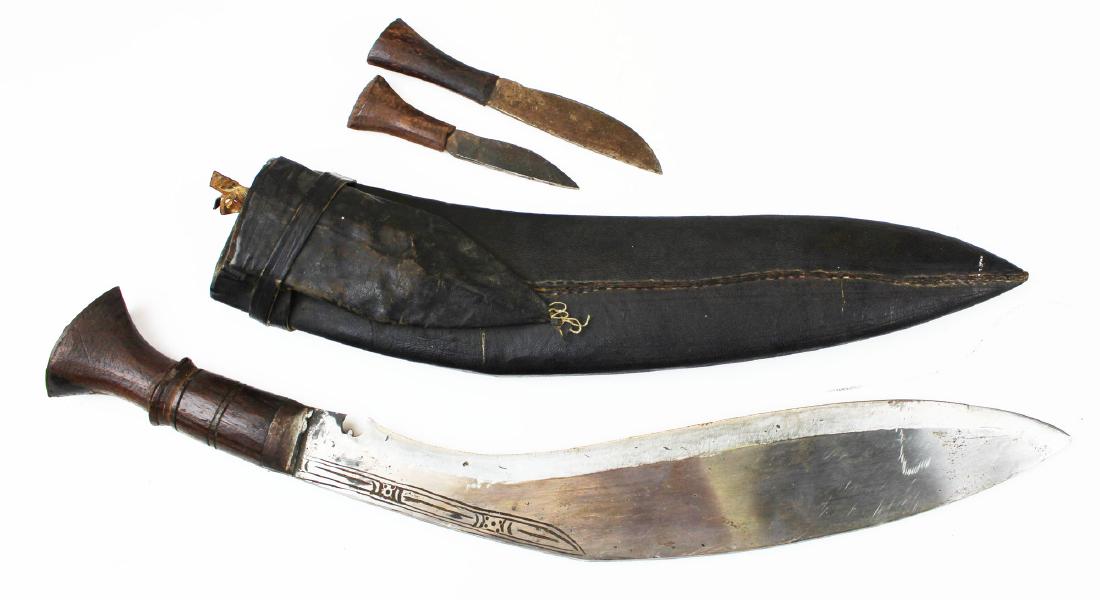 Kukuri/Ghurka knife: Nepalese Kukuri or Ghurka Knife Approx 12.5" blade 16.5" overall with scabbard and two smaller knives