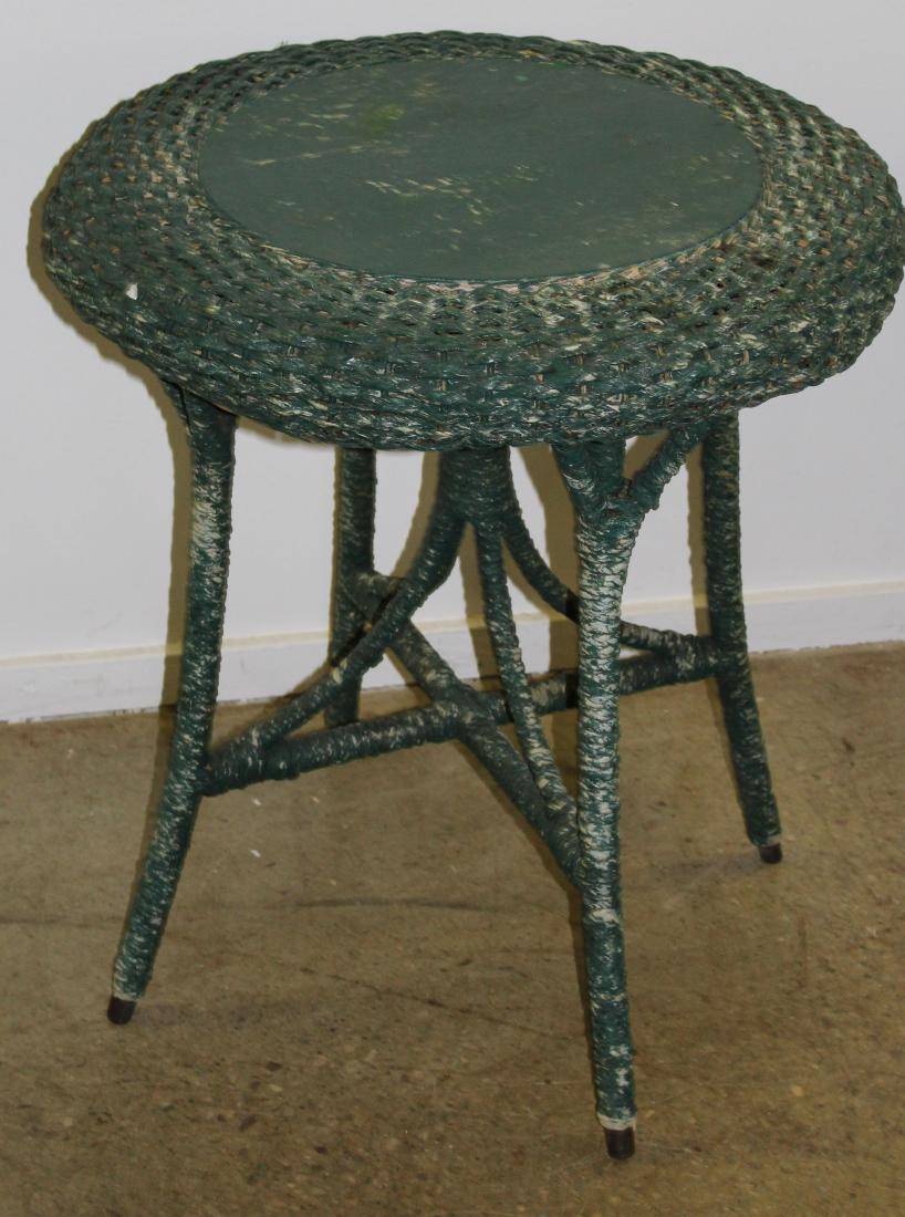 Round wicker table: Round green painted wicker table signed Fred Johnson Fiber Rush. 26"d x 29"h