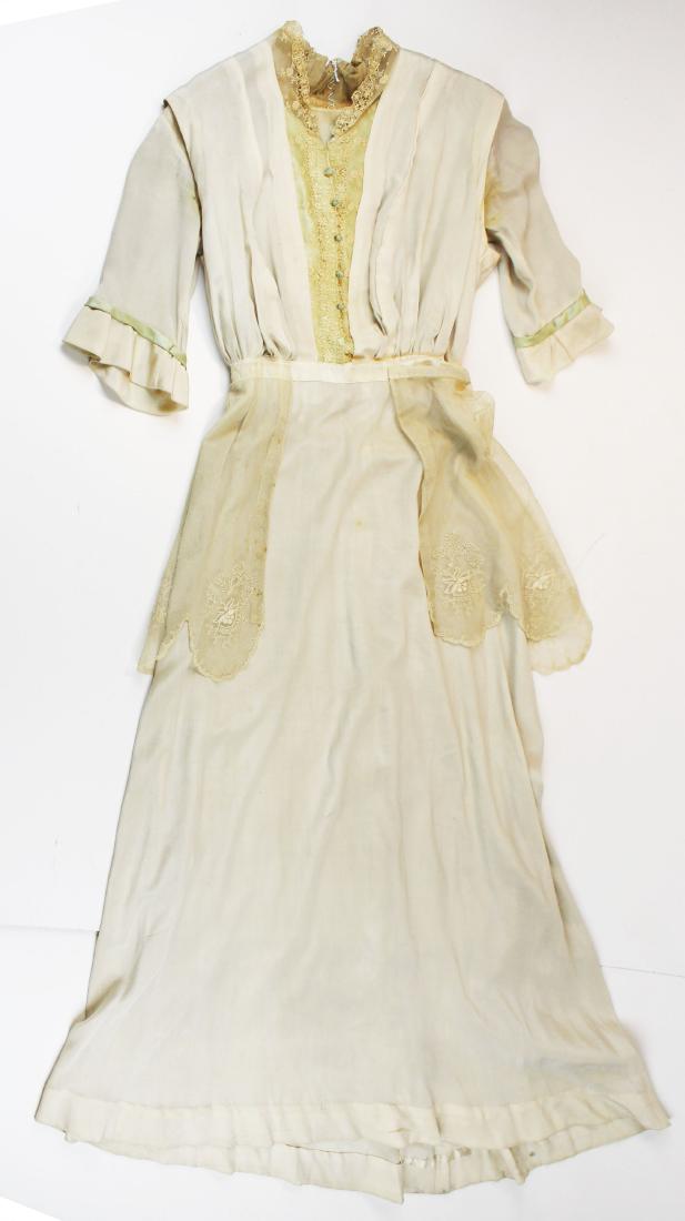Edwardian ecru silk button fron dress: vintage Edwardian era ca. 1915 ecru silk button fron dress with greem silk and lace lapels, network bustle, shoulder width 15", waist 11", sleeves 13.5", overall length 56" (measurements laid flat)