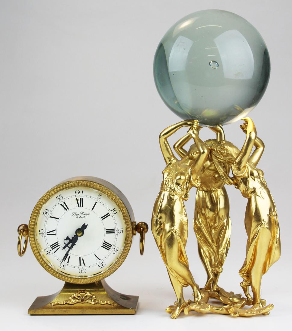 2 contemporary gilt brass decorative objects: 2 contemporary gilt brass decorative objects- Flower Lavigne desk clock (crystal broken), 3 Graces glass ball, hts 6", 13 1/2"