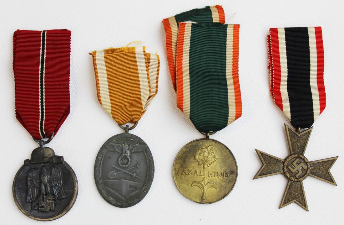 four WWII German medals with ribbons: four WWII German Third Reich Nazi medals- Azad Hind (Free India), 1941 Winterschlacht, West Wall medal, 1939 Merit Cross w/o swords, each 1 1/2"