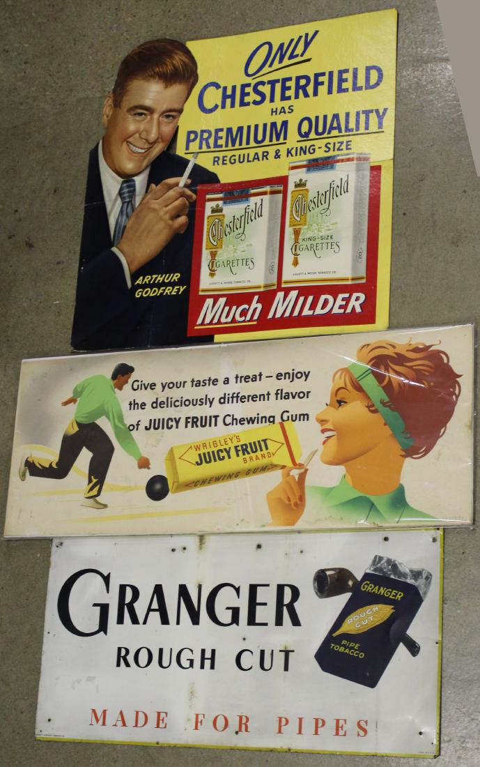 Three 20th c Trade signs: Wrigley's Juicy Fruit Bubble Gum cardboard litho trolley card 11 x 28", Granger Rough Cut pipe tobacco tin litho sign 11 x 23" Chesterfield Cigarette litho store display sign 20 x 20"