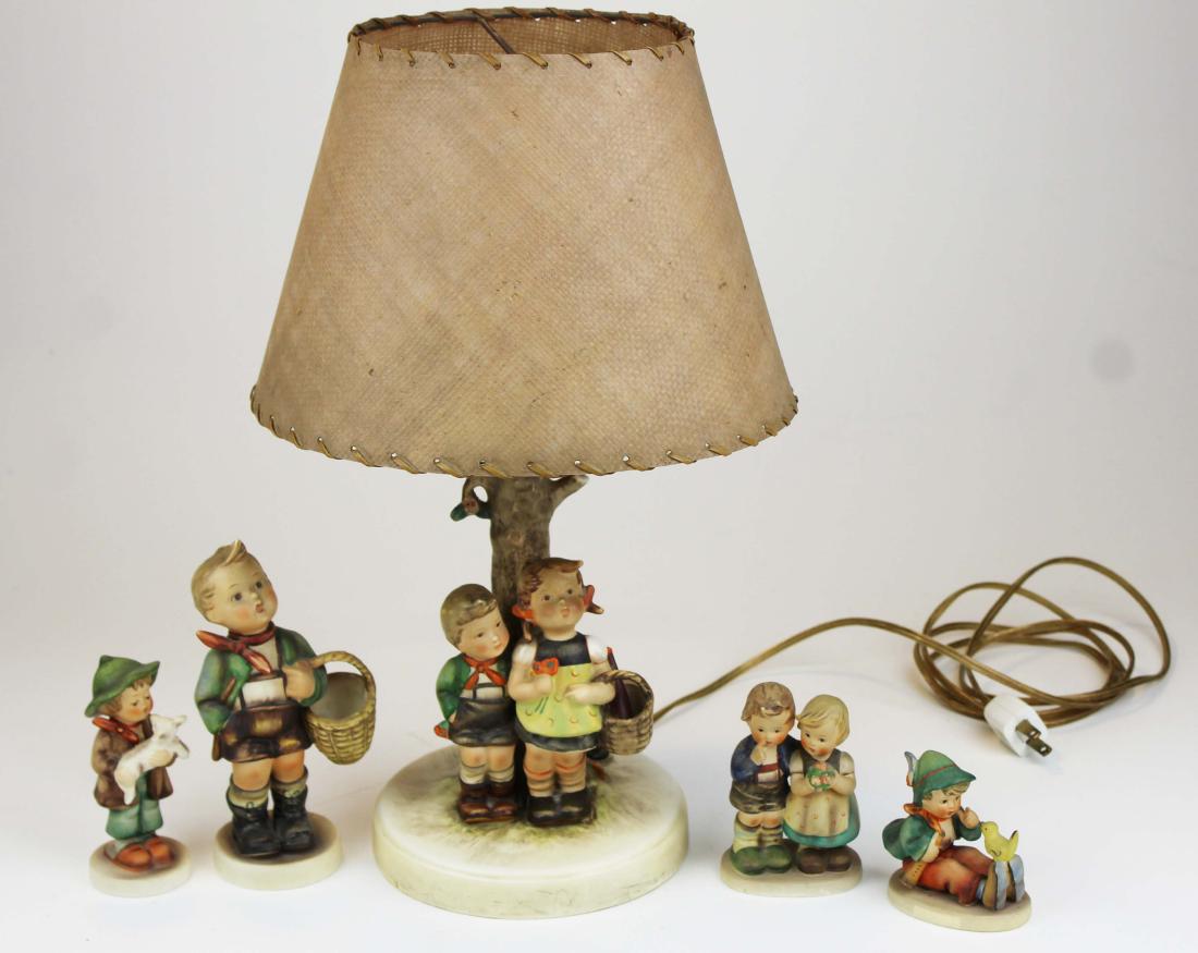 group of Hummel's incl. lamp, full bee figurines: group of Hummel's including full bee mark table lamp, 7" large full bee figurine, 3 other later figurines, 5 pcs. total , ht. 3.25" -12"