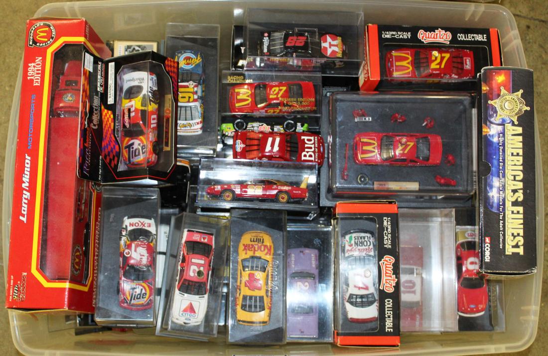 tote full of1:43 scale diecast race cars: tote full of 1: 43 scale diecast race cars in original packaging- fifty plus pieces (actual count unverified)