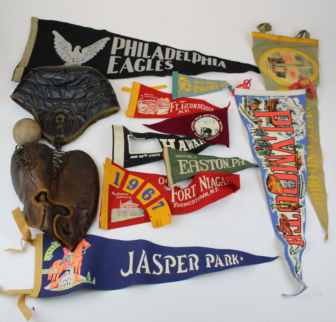Sports lot: Lot including early glove, football helmet and variety of pennants