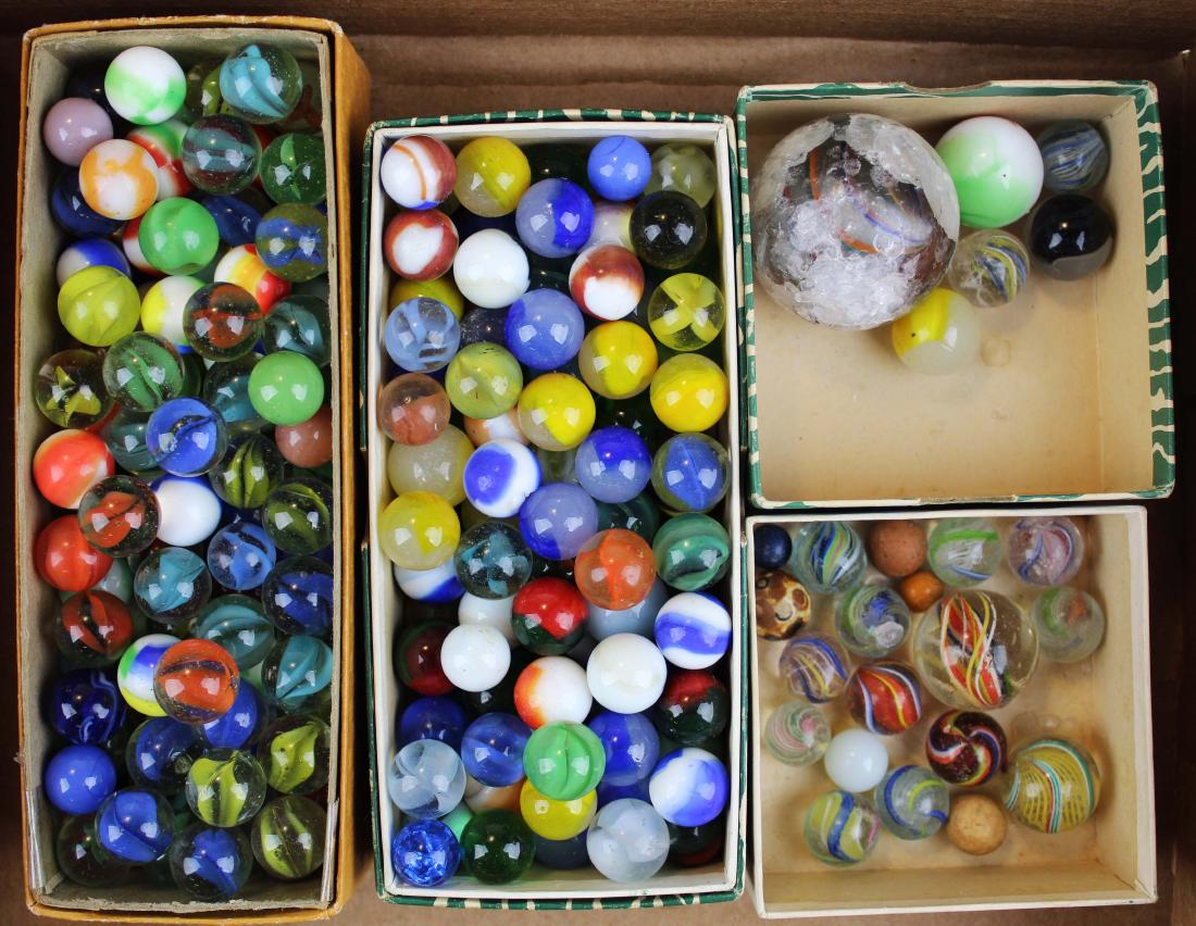 lot of glass, clay, and pottery marbles: lot of glass, clay, and pottery marbles including early swirl cane, shooter (with many chips and nicks), etc.