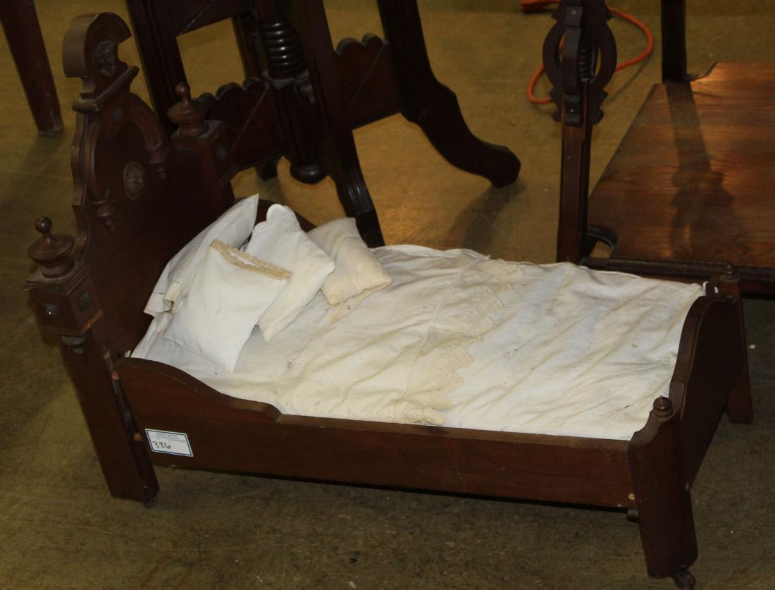 Victorian black walnut high back doll's bed (1 of 1)