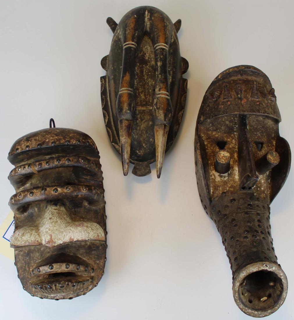 Three Bete masks: Three Carved African masks attributed to the Bete people of Ivory Coast