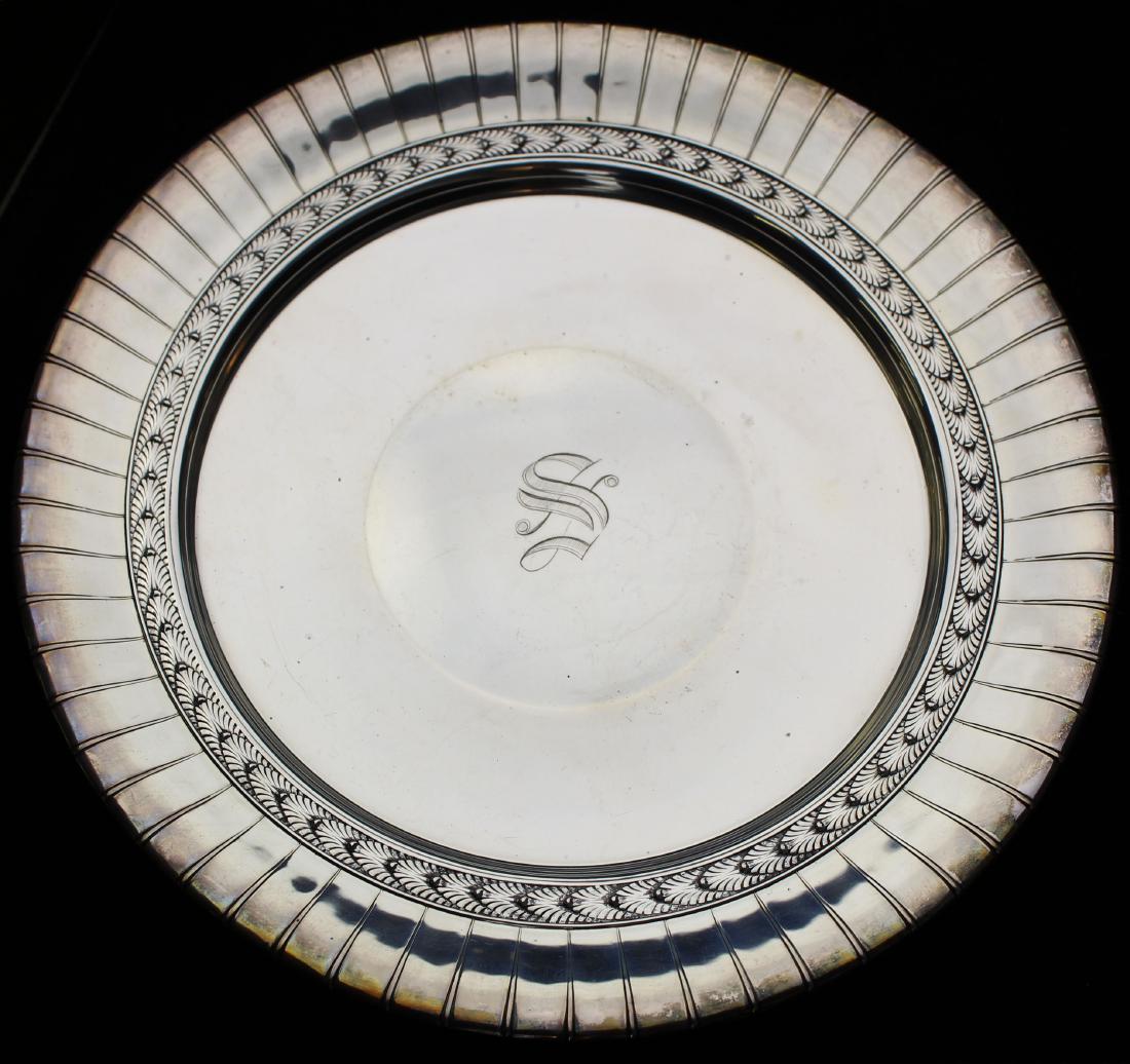 International sterling silver footed salver: International sterling silver round footed salver dish with Art Deco style palm frieze ribbed border, gothic script "S" monogram in center 10" dia. 12.3 troy oz.