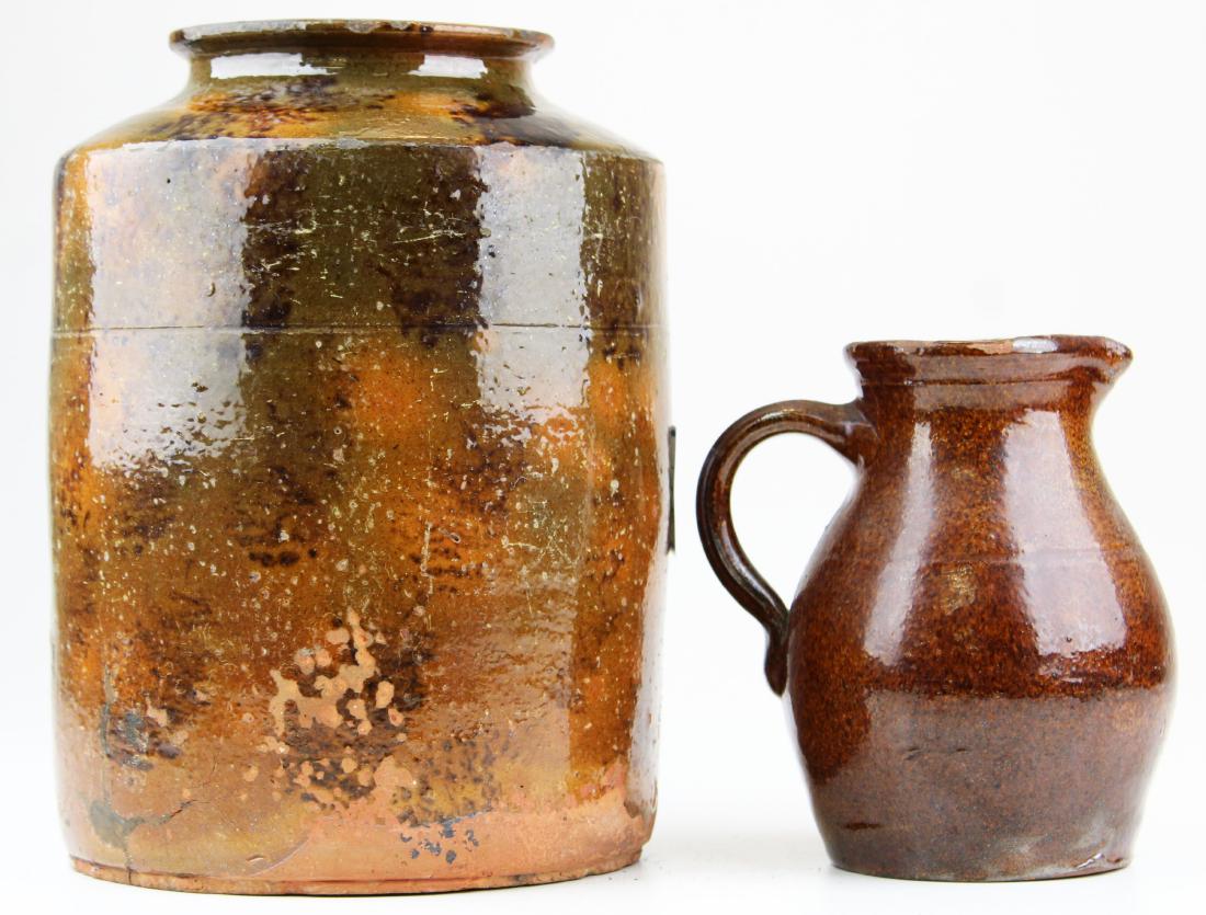 early 19th c Maine redware crock, pitcher: early 19th c State of Maine redware crock, incised ring below shoulder, wear, glaze flaking, minor losses, ht 9 1/2", small redware pitcher, glaze flakes, ht 6"