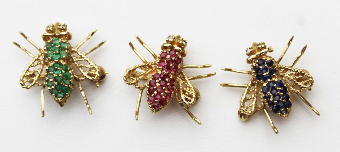 Set of 3 bee yellow gold pin pendants.: Set of 3 bee 14k y.g pin pendants one bee set with 20 small rd rubies, one set with 20 sm. Rd sapphires, and one set with 20 small rd emeralds. Each bee or fly 3/4" long.