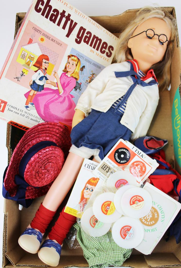 Mattel Chatty Cathy Charmin' Chatty, game: Mattel Chatty Cathy "Charmin' Chatty" doll with Chatty Games including 10 Chatty records, passport, clothes, & French phrase book, pull string mechanism works but sound is fuzzy, ht 24"