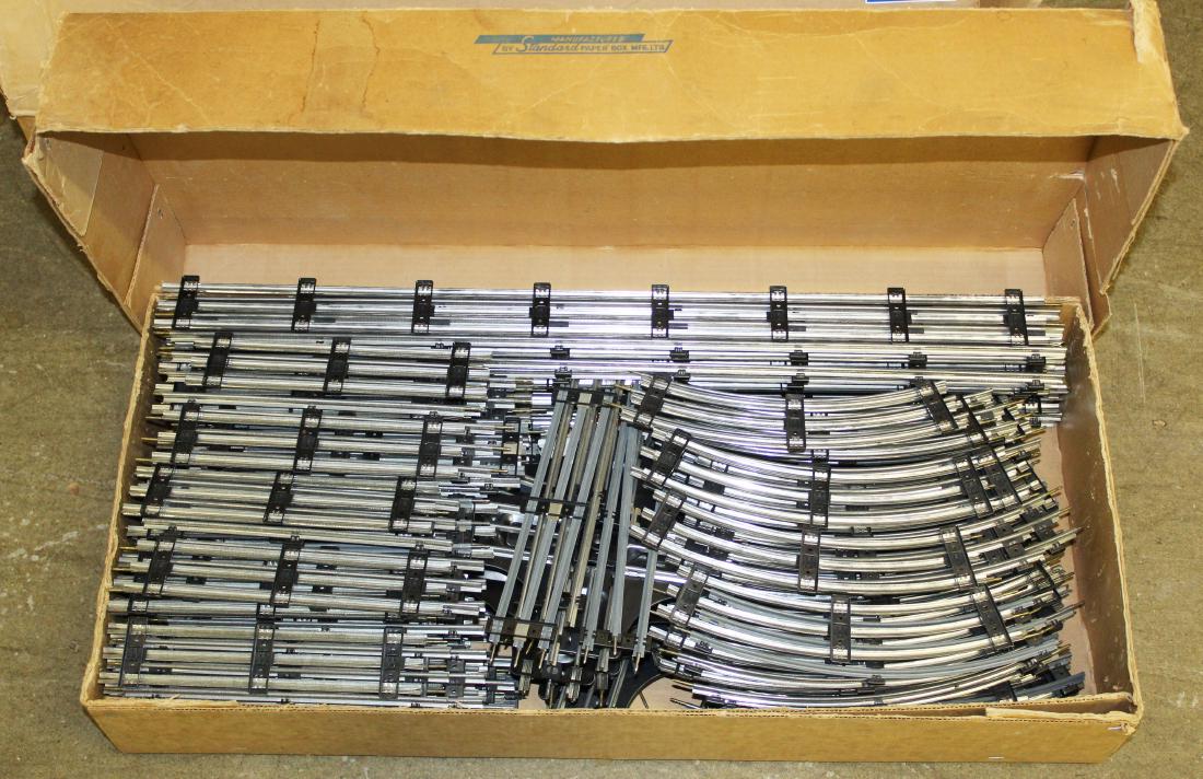 large lot of Roll-it train track in original boxes: large lot of Roll-it train track in original boxes (descending from the owners of the company in Montreal), three cases including boxed new old stock