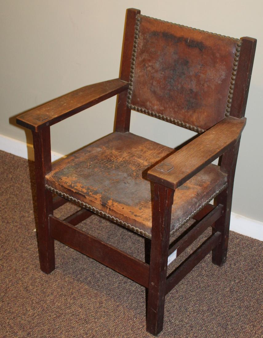 Gustav Stickley Arts and Crafts leather armchair: signed Gustav Stickley 1912-1916 brand mark Arts and Crafts era Mission style quartersawn oak pegged and through tenoned armchair with original brass studded leather upholstery- wear to upholstery 37.