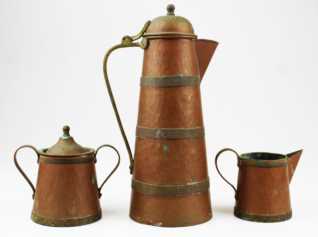 Arts and Crafts hand hammered 3 pc. Coffee set: Arts and Crafts style hand hammered copper brass banded 3 pc. Coffee set including coffee pot, covered sugar bowl and creamer 11" x 4", 5" x 5" 3.75" x 4.5"