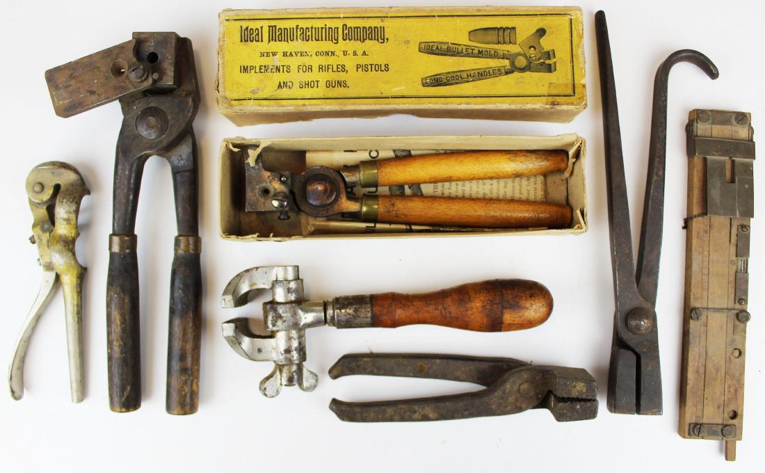 11 Bullet molds: Lot fo 11 bullet molds and tools including Ideal 456191 Grs 300 in original box, 30 cal mold, unusual hand vice, 2 pairs of tongs, unusual primer tool and a wood level with brass sighting device.