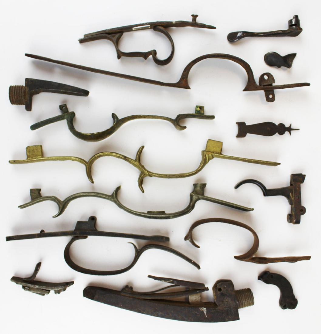 Lot of 19th and 20th c gun parts: Lot of 19th and early 20th c gun parts incl 7 trigger guards, breech plug, parts, some are early brass.
