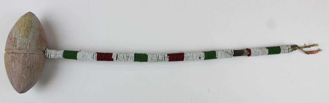 Northern Plains sinew sewn pecked stone club: late 19th c Northern Plains sinew-sewn pecked stone war club, overall length 17 3/4"