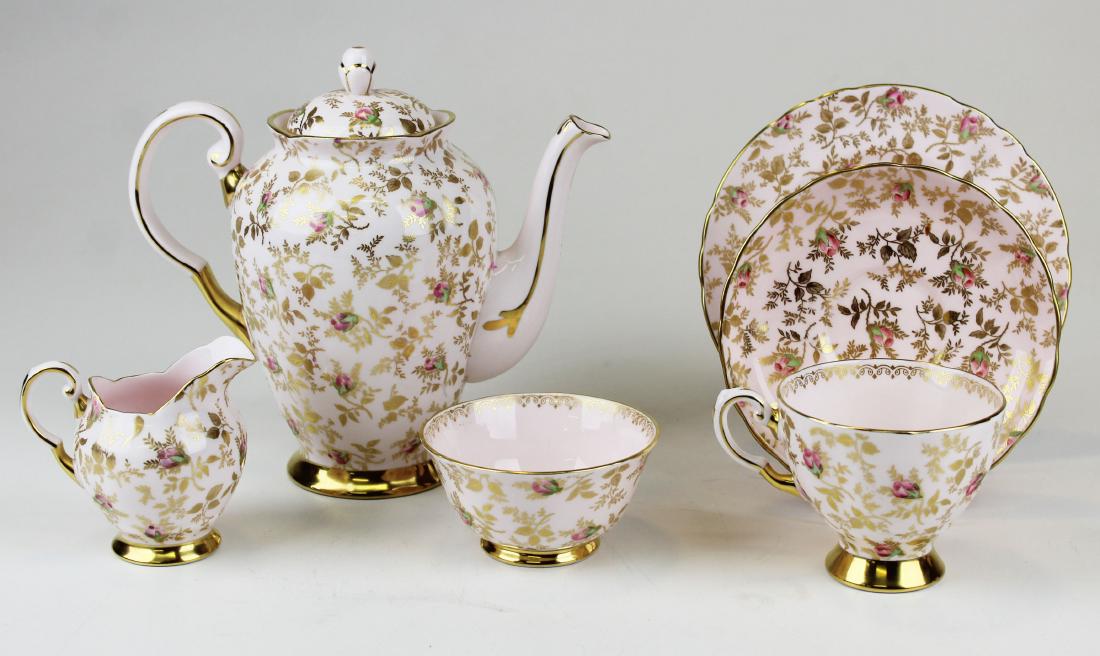 Tuscan English Bone China tea service for 8: Tuscan English Bone China rose chintz style pattern tea service for 8 including tea pot, sugar and creamer, 8 cups and saucers, and 12 dessert plates