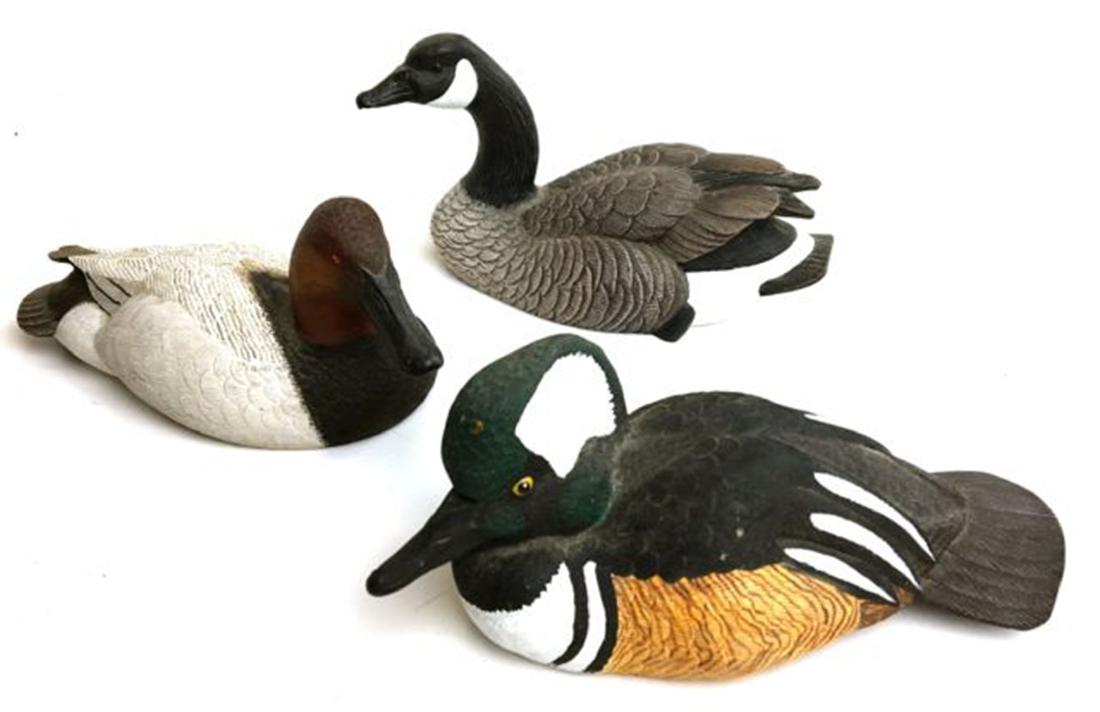 A group of 3 Roger Desjardins miniature decoys: A group of 3 Roger Desjardins miniature decoys. Each hand signed and dated including canvasback 6" l, Hooded merganser 6" l, and Canadian goose 6" long. Good condition. Fine details and paint.