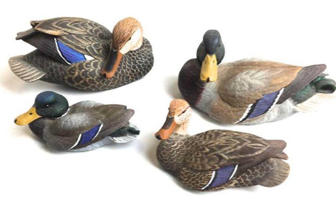 A group of 4 Roger Desjardins miniature decoys: A group of 4 Roger Desjardins miniature decoys. Each with original tag. Two pair of Mallards. One pair 5" long second pair 3 1/2" long. Fine details and paint.