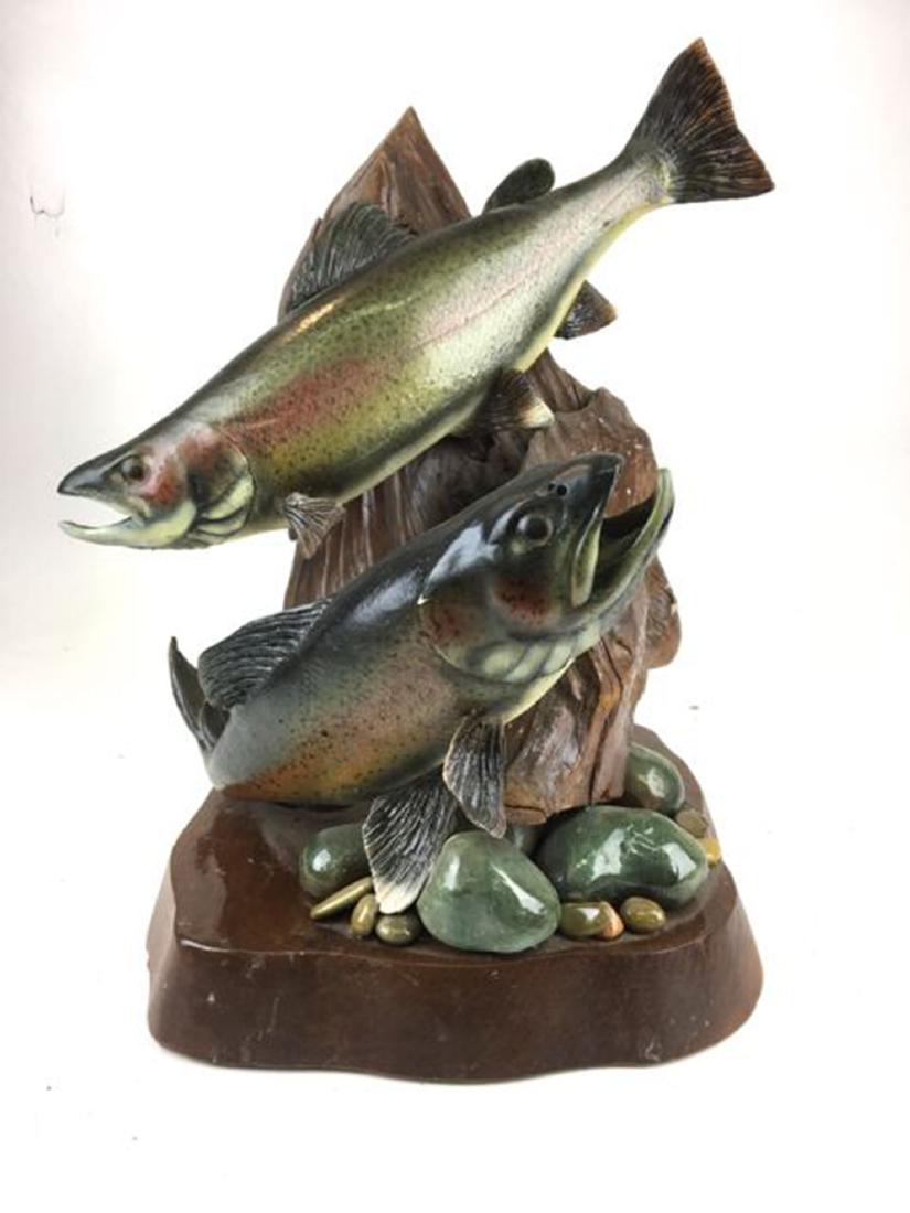 Pair of carved and painted rainbow trout: Two carved and painted rainbow trout mounted to carved stump. Fish 18" long, sculpture 19" h. Good condition.