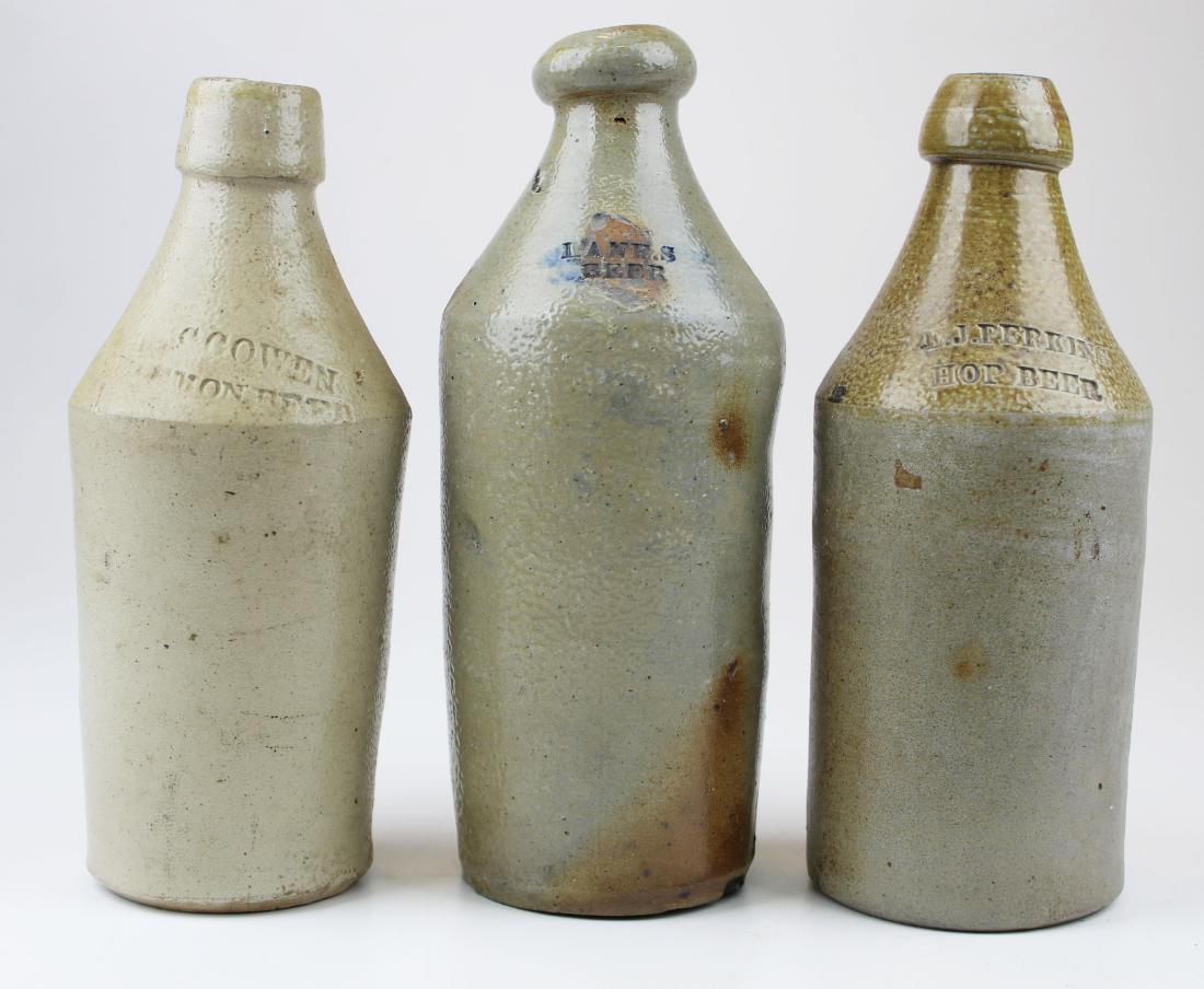 Lane's, Perkins Hop, Cowen Lemon beer bottles: three stoneware beer bottles- E J Perkins Hop Beer, Cowen Lemon Beer, Lane's Beer, hts 9 1/2" to 10"