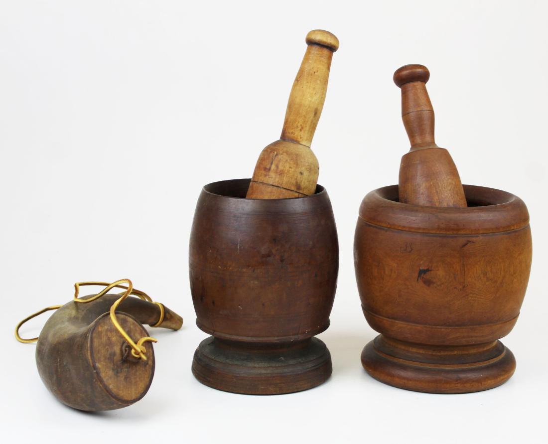 two mortars & pestles, early powder horn: two mortars & pestles, early powder horn