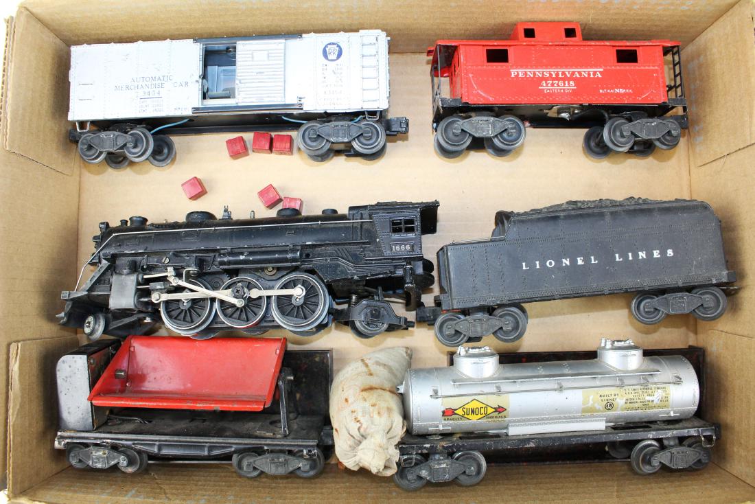 Lionel 1666 engine, 3454 Automatic Merchandise: Lionel 1666 locomotive, tinplate cars & accessories including 3454 Automatic Merchandise car, 3559 coal car with coal, 2466 Sunoco, 2472 lighted caboose (possibly an owner modification), 2466T tender